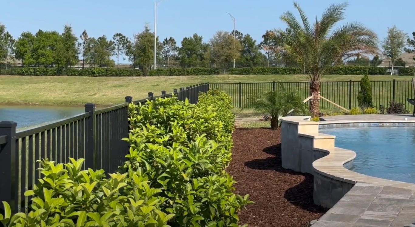Waterfront landscape with native Florida plants in Westchester, FL